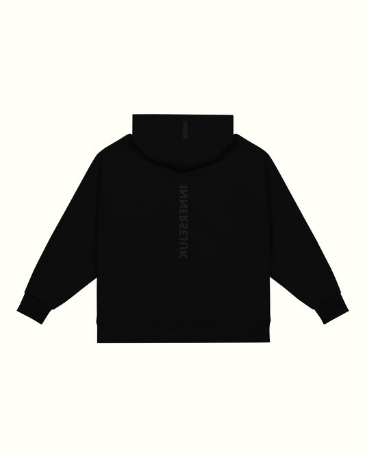 THE REVERSE RELAXED HOODIE  IN BLACK